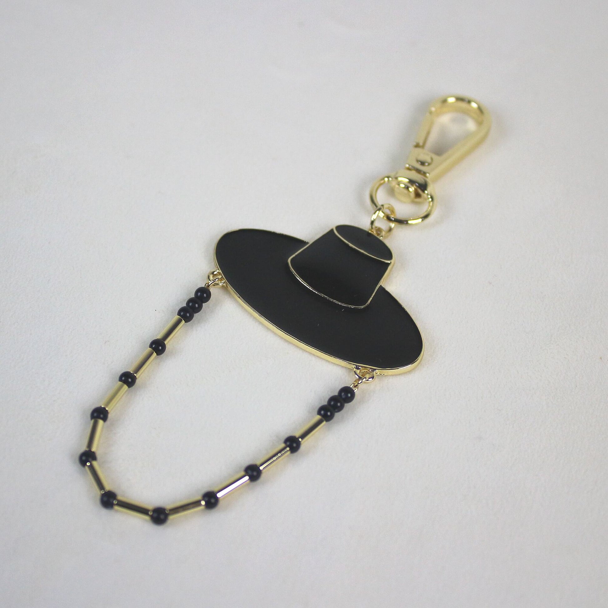 Full view of the Midnight Shadow Hunter Key Ring showing Korean heritage inspired hat design and dark shadow style.