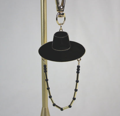 Close up of Midnight Shadow Hunter Key Ring featuring Korean traditional hat shape with subtle golden detail.