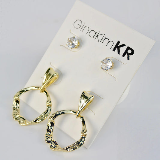 Front view of Molten Circle Earring Set by GinaKimKR showing gold textured hoops and CZ studs on product card
