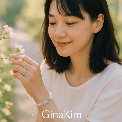 A woman wearing the Moonlit Harmony Bracelet by Gina Kim, showcasing moonstone beads with silver shimmer and an adjustable macramé finish. Gentle and radiant.