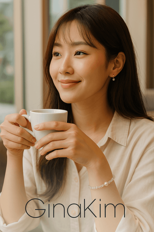 A woman wearing the Silent Wish Bracelet by Gina Kim, featuring clear crystal quartz, one central freshwater pearl, and gold details. Soft, elegant, and meaningful.