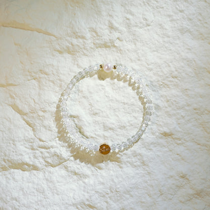 Handmade bracelet with faceted crystal quartz, one freshwater pearl, and gold-plated spacers. Designed by GinaKimKR for quiet elegance and inner clarity.